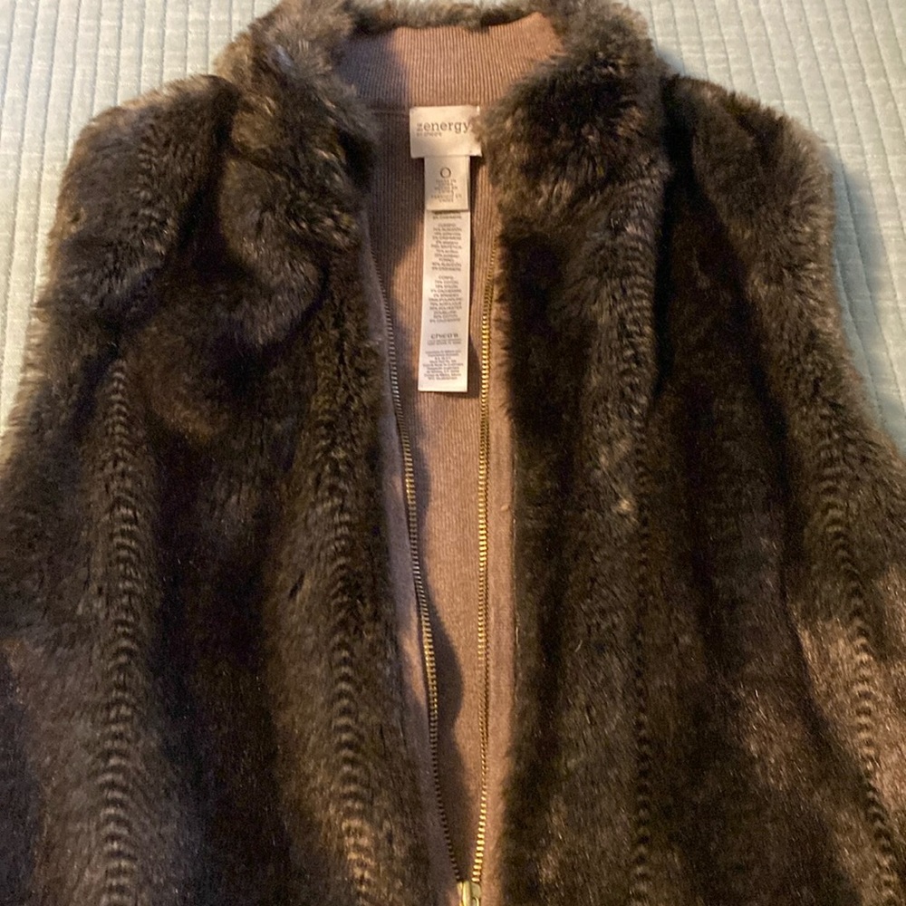 Sleeveless vest with gold zipper, tan sweater material on back.  Fits small